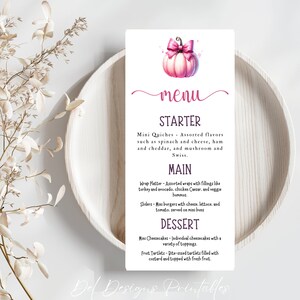May include: A printable menu template with a pink pumpkin illustration and the word "menu" in a cursive font. The menu is divided into sections for starter, main, and dessert. Each section lists food items with descriptions.