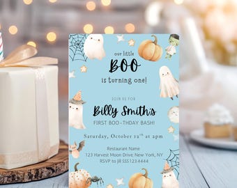 May include: A light blue Halloween-themed invitation with watercolor illustrations of ghosts, pumpkins, and a spider. The text reads "our little BOO is turning one!" and invites guests to Billy Smith's first birthday bash on October 12th.