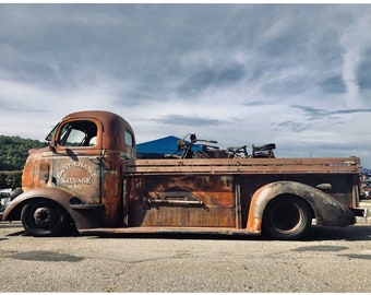 Rusty Treasures Art Print: Last Chance Salvage Truck & Motorcycle – Vintage Journey Under a Cloudy Sky