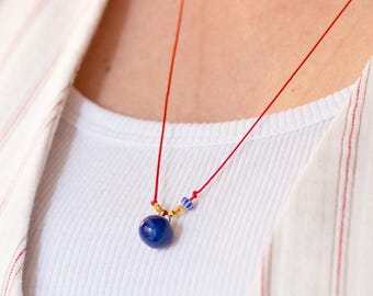 Red String Necklace: Blue Ceramic Bead, Gold Accents, Adjustable Cord