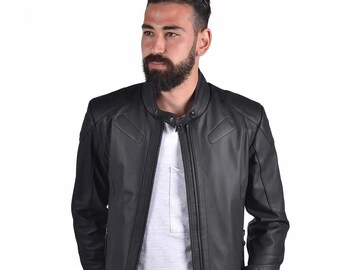 May include: A black leather jacket with a zipper closure and a stand-up collar. The jacket has a quilted design on the sleeves and a pocket on the left chest.