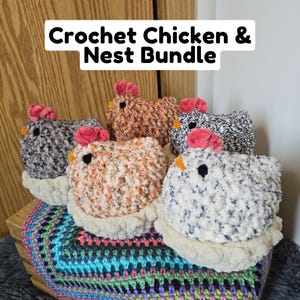 May include: A set of five crocheted chickens in a nest. The chickens are made in various colors, including white, brown, and black. The nest is made of white yarn.