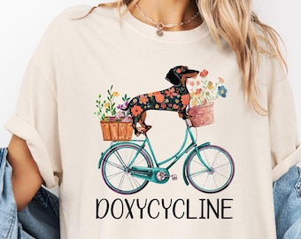 Doxycycline Pharmacy Pun Shirt, Dachshund on Bicycle Shirt,  Veterinary Shirt, Pharmacy Gift, Pharmacist Shirt, Dachshund Shirt