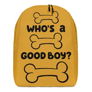 May include: A yellow backpack with the text "Who's a good boy?" and three black outlines of dog bones.