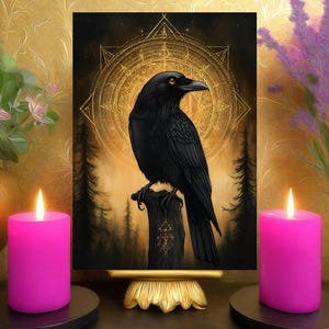 May include: A framed print of a black raven on a wooden post, set against a golden, celestial backdrop. Either side of the print are two lit, bright pink candles on black bases, with floral arrangements in gold vases. The artwork has a mystical theme.
