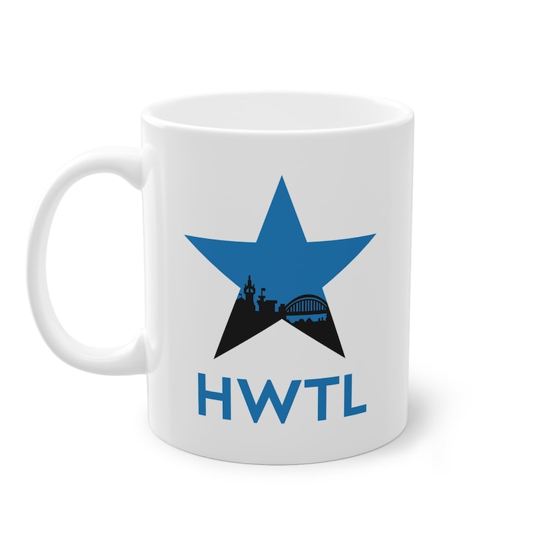 May include: White ceramic mug with a blue star design and a black cityscape silhouette. The mug features the blue letters "HWTL". The mug has a curved handle.