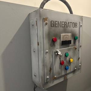 May include: A gray metal box with the word "GENERATOR" printed on it. The box has a variety of buttons, a keyhole, and a small gauge with a needle pointing to the number 20.