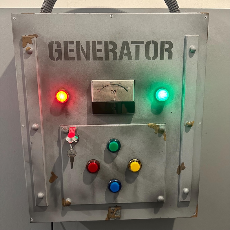 May include: A gray metal panel with the word "GENERATOR" printed in black. The panel has a red light, a green light, a gauge, a keyhole, and five colored buttons.