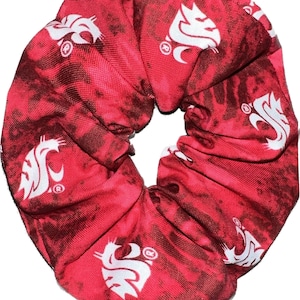 May include: Red and white scrunchie with a tie-dye pattern and a white Washington State Cougars logo repeated throughout.