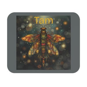 May include: A decorative image of a stylized insect with intricate wing patterns in shades of orange, yellow, and green. The insect is centered against a dark background with bokeh effects. The word "Tam" is written in yellow at the top.