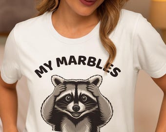 Funny Raccoon Graphic Tee | “Lost My Marbles” Expression Shirt – Cartoon Animal Humor T-Shirt for Adults