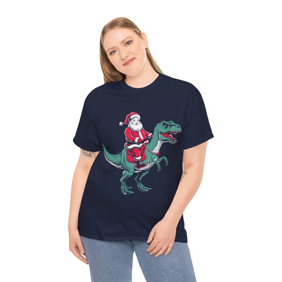 Santa Riding Dinosaur Christmas Tee – Funny T-Rex Holiday Shirt for Kids & Adults, Xmas Family Matching Gift