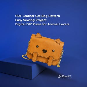 May include: A tan leather cat-shaped bag with a gold chain strap. The bag features a black nose, button eyes, and ear-shaped flaps. Text on the image reads: "PDF Leather Cat Bag Pattern, Easy Sewing Project, Digital DIY Purse for Animal Lovers."