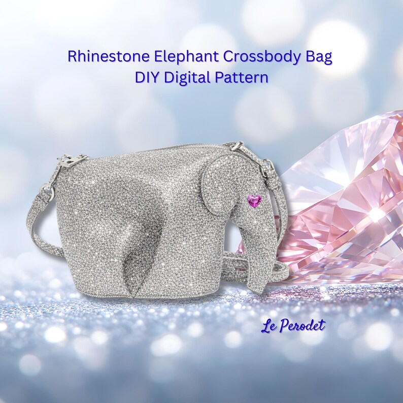K&ouml;nnte beinhalten: Silberne Strass-Elefanten-Umh&auml;ngetasche mit einem rosa Herzdetail am Ohr. Die Tasche hat einen Rei&szlig;verschluss und einen Schulterriemen. Der Text auf dem Bild lautet "Rhinestone Elephant Crossbody Bag DIY Digital Pattern" und "Le Perodet".