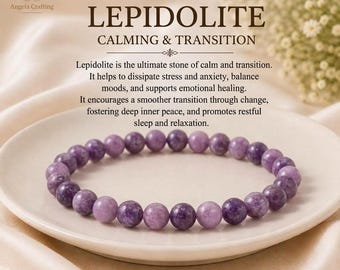 May include: A beaded bracelet made of round, polished purple lepidolite stones. The bracelet is arranged in a circle on a white ceramic plate. Above the bracelet, text reads: LEPIDOLITE CALMING & TRANSITION, followed by a paragraph about the stone.