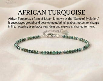 May include: A delicate bracelet featuring small, faceted African turquoise beads interspersed with tiny silver-toned metal spacers. The jewelry piece includes a silver-toned lobster claw clasp, an adjustable chain, and a small heart-shaped charm.
