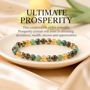 May include: A beaded bracelet featuring alternating round stones in shades of green, brown, metallic gray, and translucent yellow. The text ULTIMATE PROSPERITY and This combination of five powerful Prosperity crystals will assist in attracting abundance, wealth, success and opportunities is visible above the bracelet.