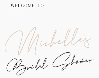 May include: A white background with the text "WELCOME TO" in black font. The text "Michelle's Bridal Shower" is written in cursive script with the name "Michelle's" in a light brown color and the words "Bridal Shower" in black. The date "04.07.24" and the text "FOLINO ESTATE WINERY" are in black font. The text "we're so glad you're here" is written in cursive script in light brown.