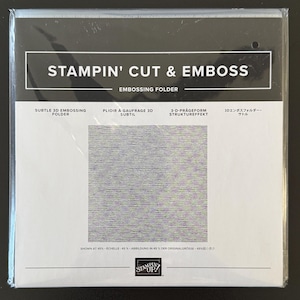 May include: A Stampin' Cut & Emboss 3D embossing folder in its original clear plastic packaging. The label features the text 'STAMPIN' CUT & EMBOSS' and 'SUBTLE 3D EMBOSSING FOLDER' with a square sample showing a fine, horizontal line texture pattern.