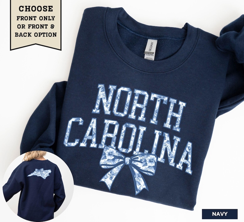 A navy blue sweatshirt with the text "NORTH CAROLINA" printed on it, along with a bow design.