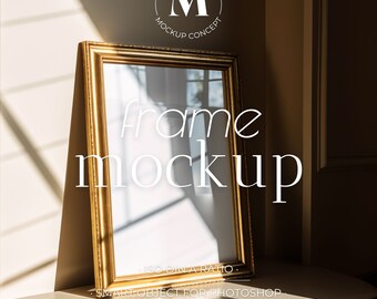 May include: A gold-colored picture frame mockup with a white background. The frame is sitting on a white surface with a brown wall in the background. The text "frame mockup" is written in white letters on the frame. The text "ISO DIN A RATIO" is written in white letters below the frame. The text "SMART OBJECT FOR PHOTOSHOP" is written in white letters below the frame. The text "PSD & JPG FILES" is written in white letters below the frame.
