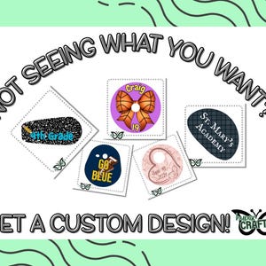 May include: An image with the text "NOT SEEING WHAT YOU WANT?" and "GET A CUSTOM DESIGN!". It features several small, square designs with text and graphics, including "4th Grade", "GO BLUE", and "St. Mary's Academy". A butterfly logo is also present.