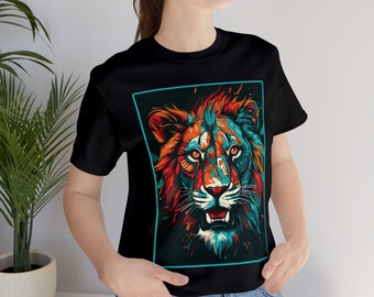 May include: A black t-shirt with a colorful graphic of a lion's face. The lion's mane is orange, red, and blue, and the background is black with splashes of paint.