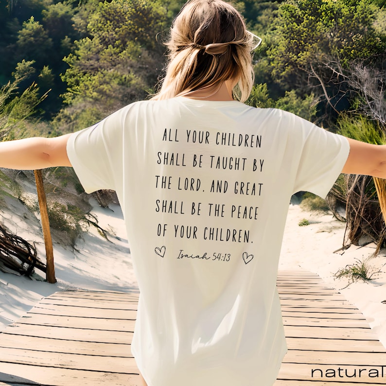 May include: White t-shirt with a black text quote on the back that reads "All your children shall be taught by the Lord. And great shall be the peace of your children. Isaiah 54:13".