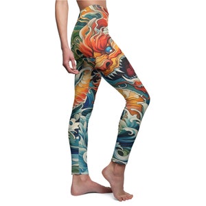 May include: Colorful leggings with a dragon and wave design. The dragon is red, orange, and yellow, and the waves are blue and white.
