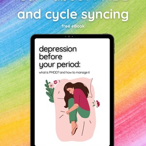 May include: A digital tablet screen displaying an ebook cover with the title "depression before your period: what is PMDD? and how to manage it". The cover features a cartoon illustration of a woman curled up in bed.