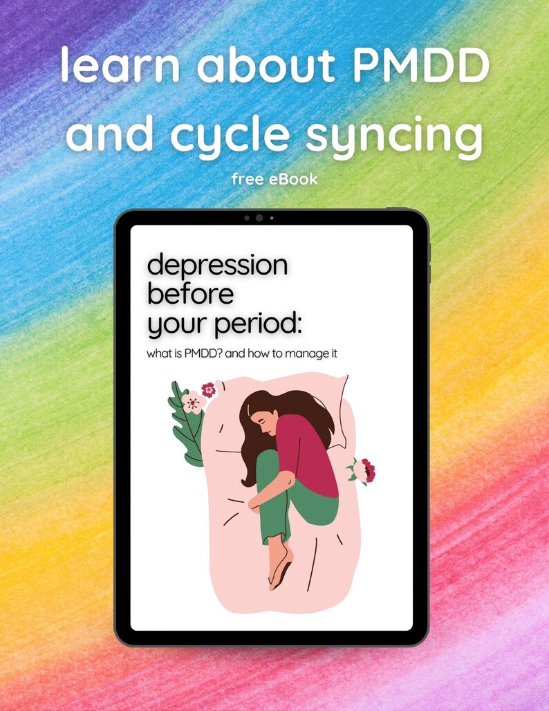May include: A digital tablet screen displaying an ebook cover with the title "depression before your period: what is PMDD? and how to manage it". The cover features a cartoon illustration of a woman curled up in bed.