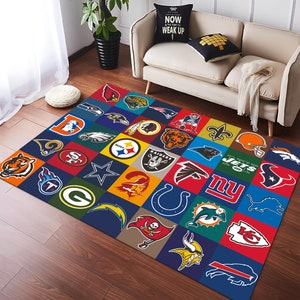 May include: A colorful rug with a patchwork design featuring logos of various NFL teams, including the Raiders, Jets, Giants, and Cowboys. The rug is made of a soft, durable material and is perfect for adding a touch of sports fandom to any room.