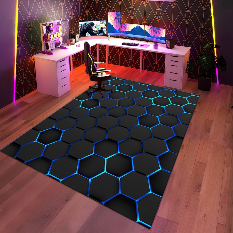 May include: A black and blue geometric patterned rug with a hexagonal design. The rug is in a room with a white desk and a black office chair.