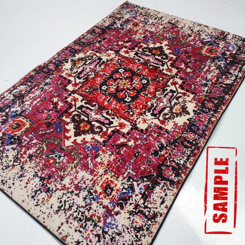 May include: A red, pink, and black patterned rug with a distressed, vintage look. The rug has a central medallion design with intricate details. The rug is labeled "SAMPLE".
