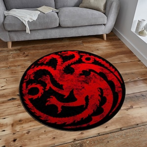May include: A round rug with a red dragon symbol on a black background. The dragon is a three-headed dragon with a distressed look.