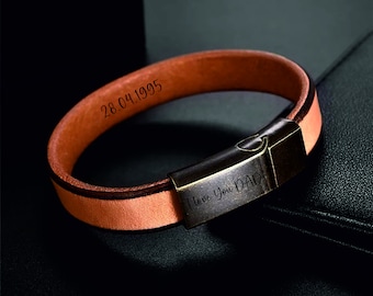May include: A brown leather bracelet with a metal clasp engraved with "I love you Dad". The bracelet also has the date "28.04.1995" engraved on it.