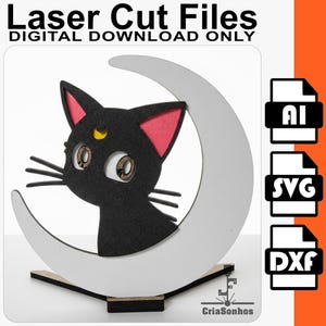 Pode incluir: Arquivo de corte a laser de um gato preto com orelhas cor-de-rosa e uma lua crescente. O gato tem olhos grandes e detalhados e uma pequena lua crescente dourada na testa. O texto "Laser Cut Files DIGITAL DOWNLOAD ONLY" está no topo.