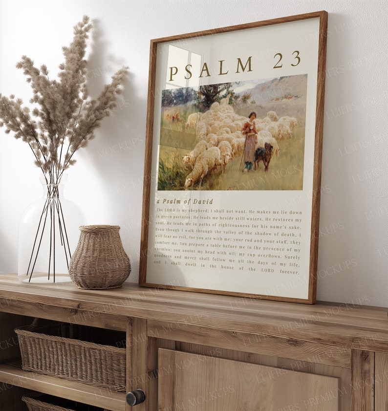 May include: A framed print of Psalm 23, a Psalm of David, with a vintage illustration of a shepherdess with a flock of sheep in a green pasture. The text is in a brown font on a cream background.
