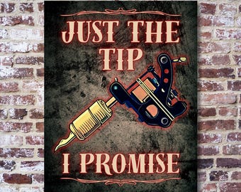 May include: A vintage-style sign with a tattoo machine and the text "Just the tip I promise". The sign has a distressed, grunge-like background.