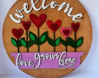 14-inch round wooden door hanger, Spring. Love grows here.