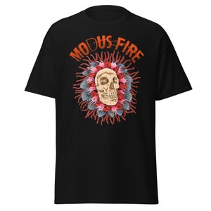 May include: Black t-shirt featuring a skull surrounded by red roses and hands, with the text "MODUS FIRE" in orange above the skull.