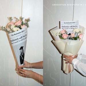 May include: A bouquet of pink and white roses wrapped in a newspaper cone. The newspaper reads "The Graduation Post" with the headline "Definitely eaR Ned it: She's ready to call the shots!" A graduation photo is visible.