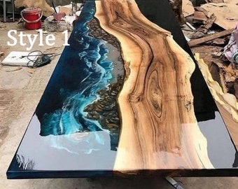May include: A large wooden table top with a blue and black epoxy resin pour. The resin has a wave-like pattern and the wood has a natural grain. The table top is labeled "Style 1".