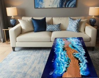 May include: A coffee table with a blue and white epoxy resin top featuring a wave design. The table has a wooden base and is sitting on a blue and white rug.