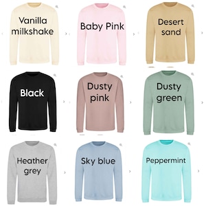 May include: A collection of nine long-sleeved sweatshirts in various colors. Colors include vanilla milkshake, baby pink, desert sand, black, dusty pink, dusty green, heather grey, sky blue, and peppermint. Each sweatshirt has a different color name printed on it.