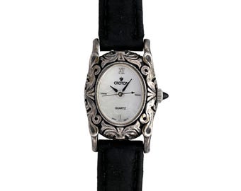 Croton Women's Ornate Silver Case Oval White Dial Black Leather Strap Quartz