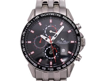 May include: A silver chronograph wristwatch with a black face and red accents. The watch face features a tachymeter scale and the text "Lucien Piccard Chronograph".