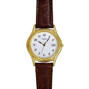 Reloj Pulsar Seiko para mujer, estilo vintage de los años 90, con esfera blanca y baño de oro japonés.