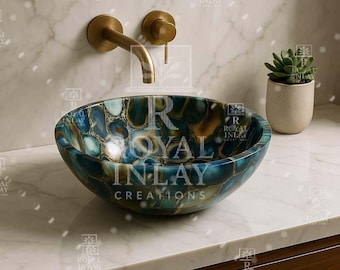 May include: A round, blue and gold agate sink with a gold faucet. The sink is made by Royal Inlay Creations.