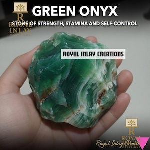 May include: A hand holding a polished green onyx stone. The stone has a layered appearance with white and brown inclusions. Text on the image reads "GREEN ONYX" and "STONE OF STRENGTH, STAMINA AND SELF-CONTROL". The brand name "ROYAL INLAY CREATIONS" is also visible.